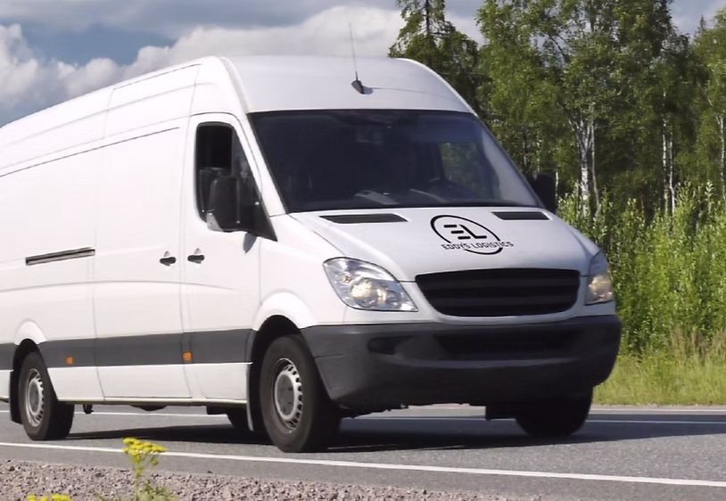Eddy's Logistics white van driving on the road for a long distance run