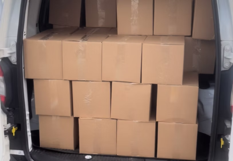 Van loaded with cardboard boxes for multi-drop delivery